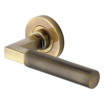 Quinta Knurled Lever Door Handle on Round Rose Brushed Antique Brass Lacquered