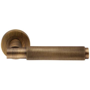 Criterion DL05 Lever Door Handle on Round Rose Antique Brass Lacquered